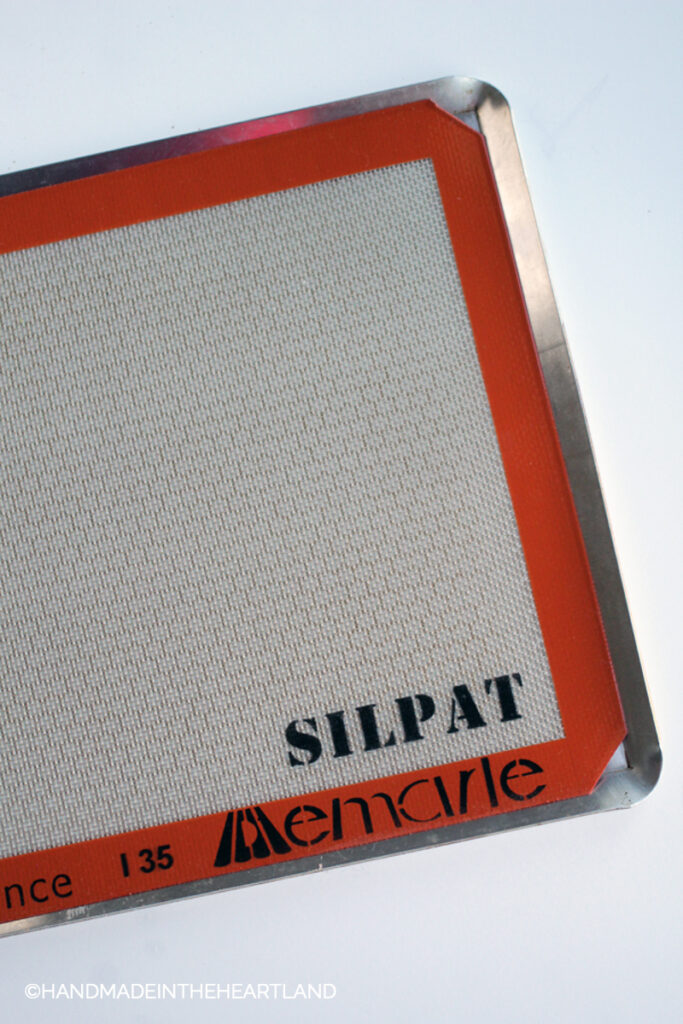 Silpat nonstick baking liner on a metal perforated baking sheet