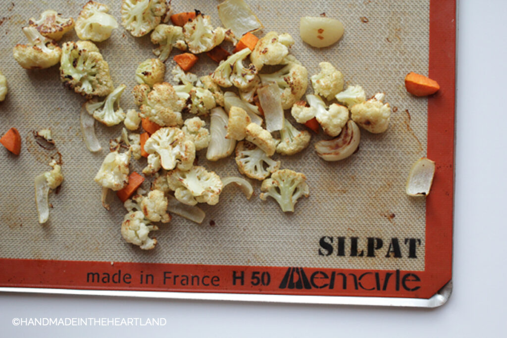 roasted cauliflower and carrots on a Silpat nonstick baking liner