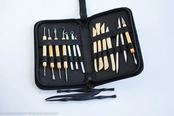 hand tools used for working with polymer clay in zipper case