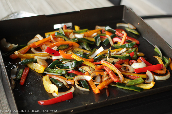 Cooked veggies about to be removed from Blackstone griddle
