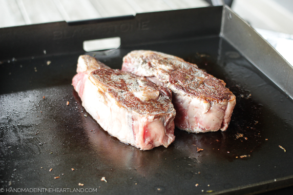 ribeye steaks on Blackstone grill