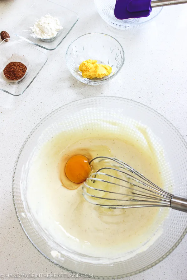 mixing in egg to eggnog cheesecake batter