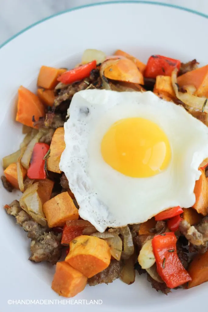 Image of roasted sausage, onions, bell pepper and sweet potato breakfast hash