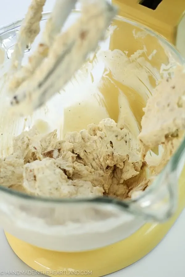 Mixing up a delicious french onion cheeseball appetizer