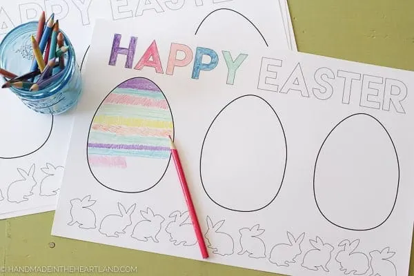 coloring page sitting on table with colored pencils