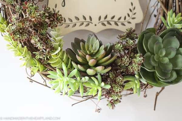 faux succulents on a grapevine wreath