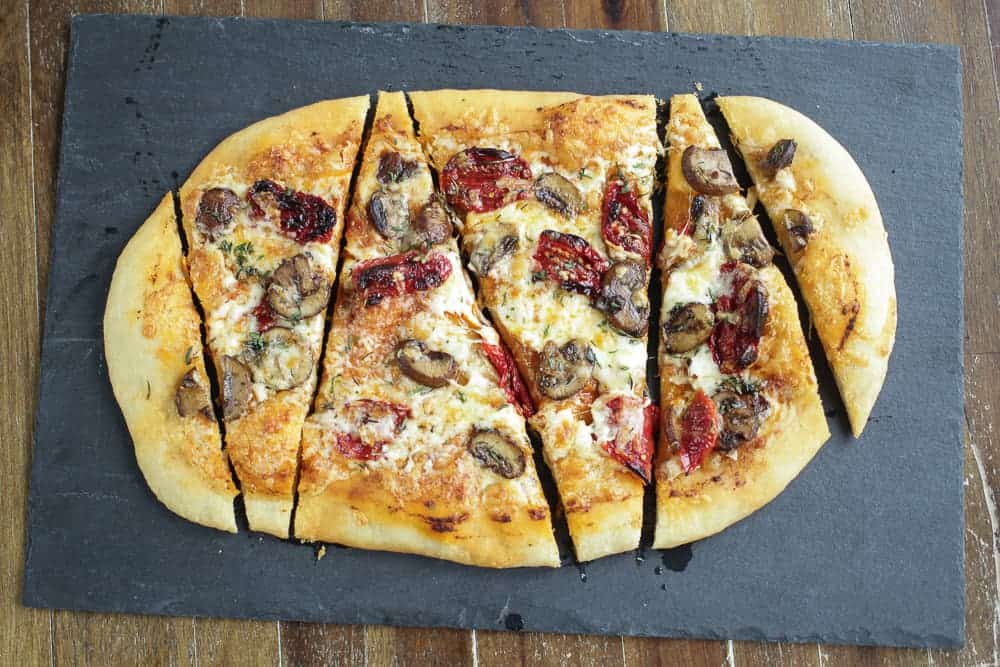 Image of mushroom and sun-dried tomato homemade pizza