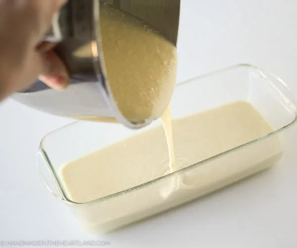 Pouring strawberry shortcake cake batter into pan