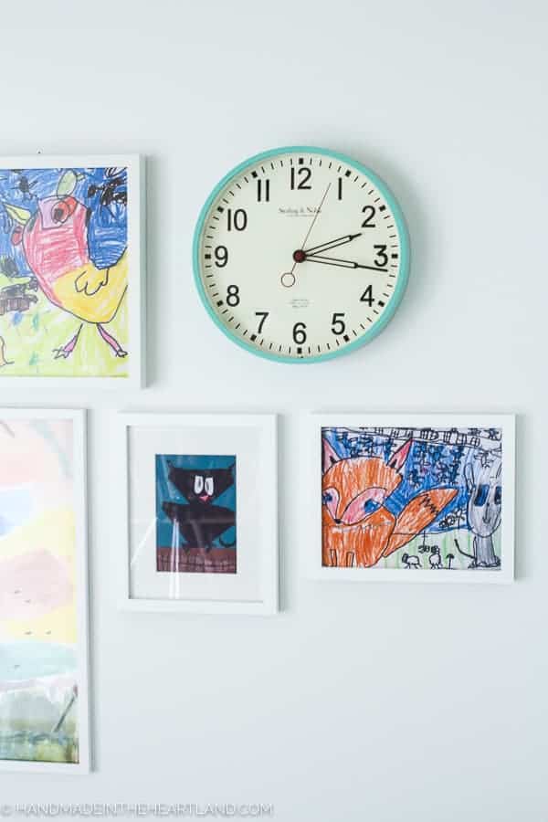 fun aqua clock and white frames purchased at walmart decorating modern kids room