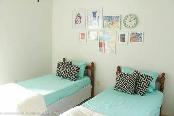 aqua bed sheets on two twin beds in a modern styled kids room