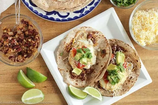 This recipe for breakfast tacos is delicious! It's the perfect breakfast to serve up for guests or to make for a brunch party. A healthy and savory breakfast recipe that any taco lover will enjoy. red bean, avocado and egg breakfast taco