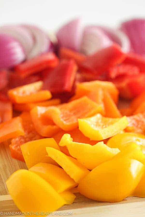 Image of cut bell peppers and onions