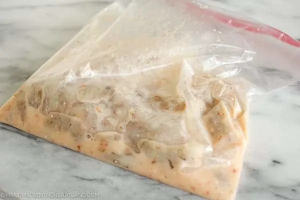 Image of ziplock bag with marinaded shrimp for skewers