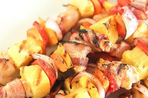 Up close image of bacon wrapped shrimp grilled skewer recipe