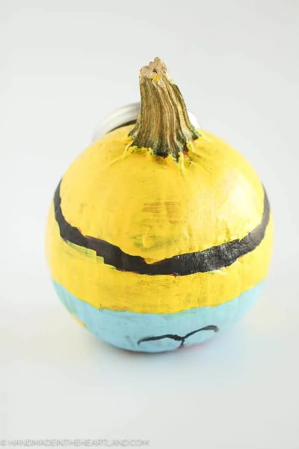 back of minion painted pumpkin