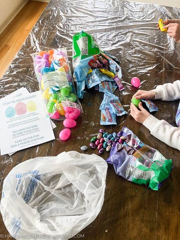 Stuffing Easter eggs for a neighbor surprise Easter egg hunt