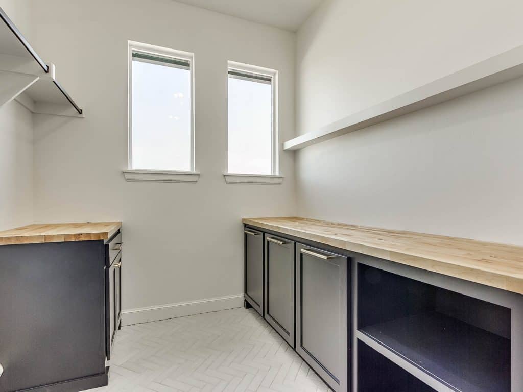 Laundry room lower cabinets & hampers painted Tricorn Black