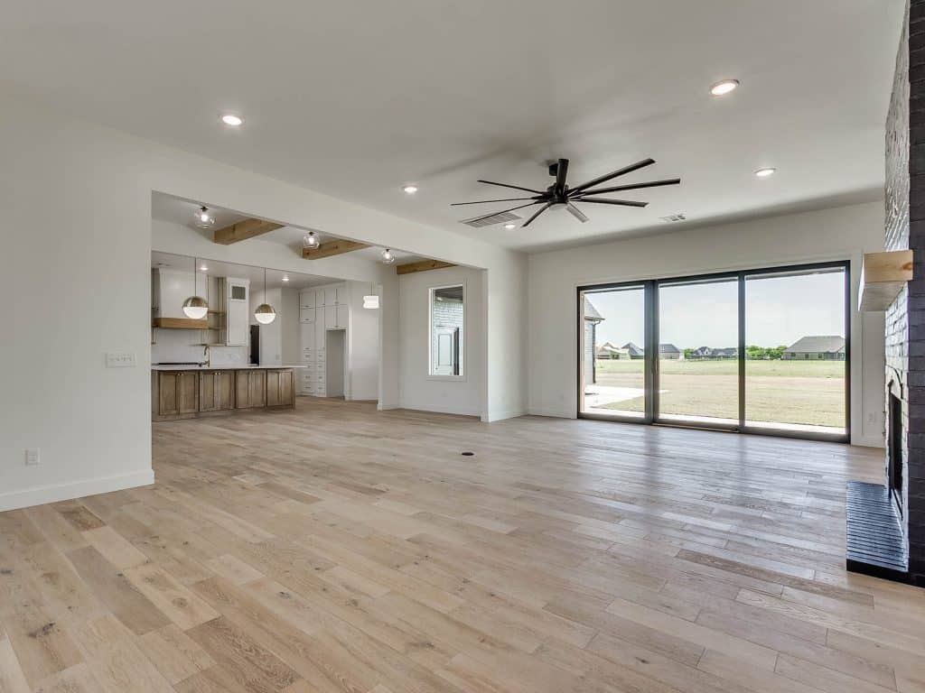 Living room and kitchen area painted in pure white