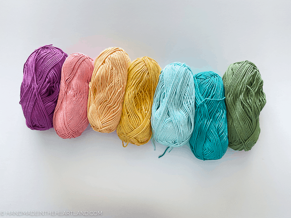Brightly colored yarn to make yarn wrapped chipboard letters