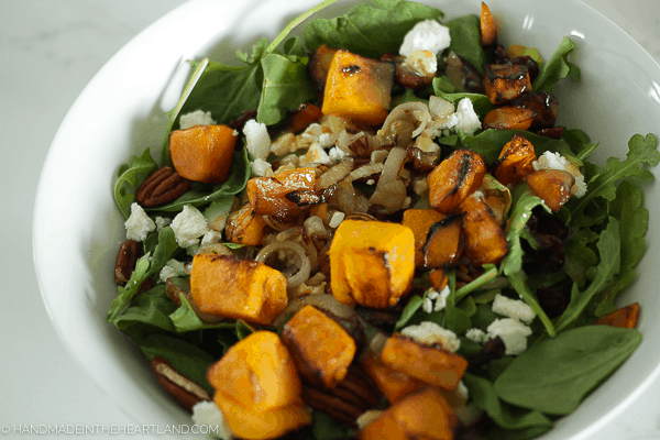 Roasted butternut squash salad with caramelized onions, pecans and goat cheese. Delicious healthy dinner