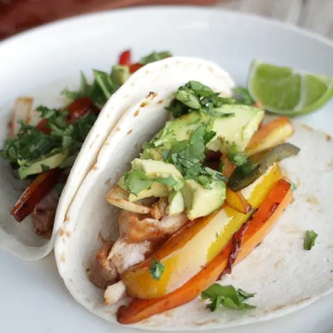 Blackstone Griddle Chicken Fajitas with avocado and cilantro