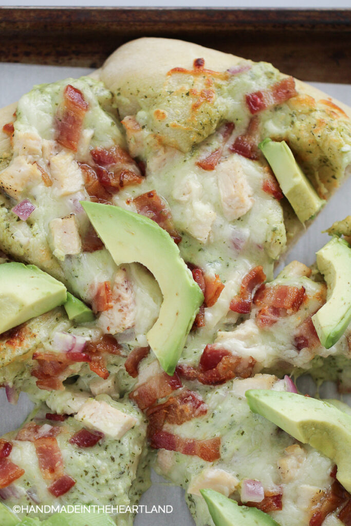 Homemade pizza with chicken, bacon, avocado and ranch
