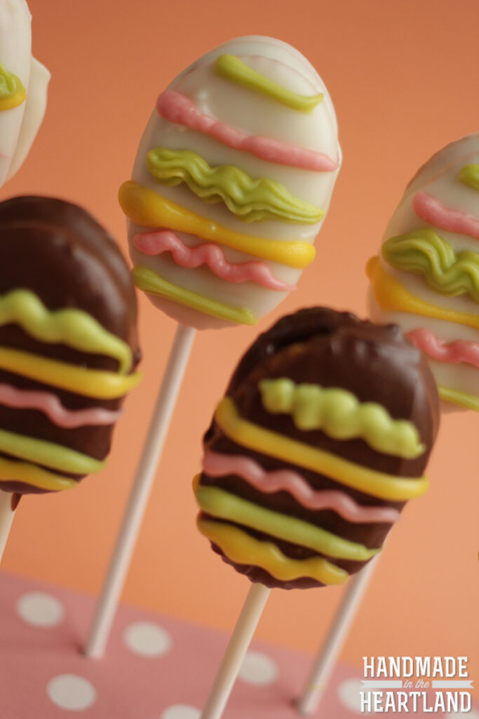 oval crackers sandwiched with peanut butter and then covered in chocolate and decorated to look like Easter Eggs