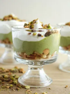 pistachio pudding in a parfait cup with whipped topping