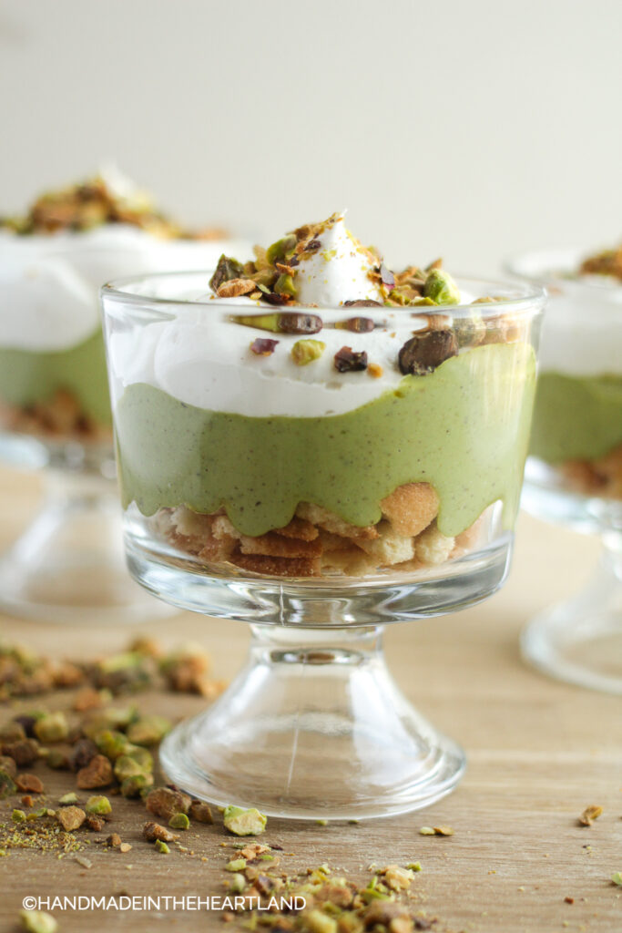 pistachio pudding in a parfait cup with whipped topping