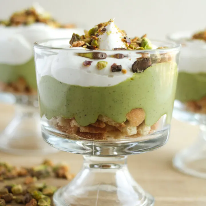 pistachio pudding in a parfait cup with whipped topping