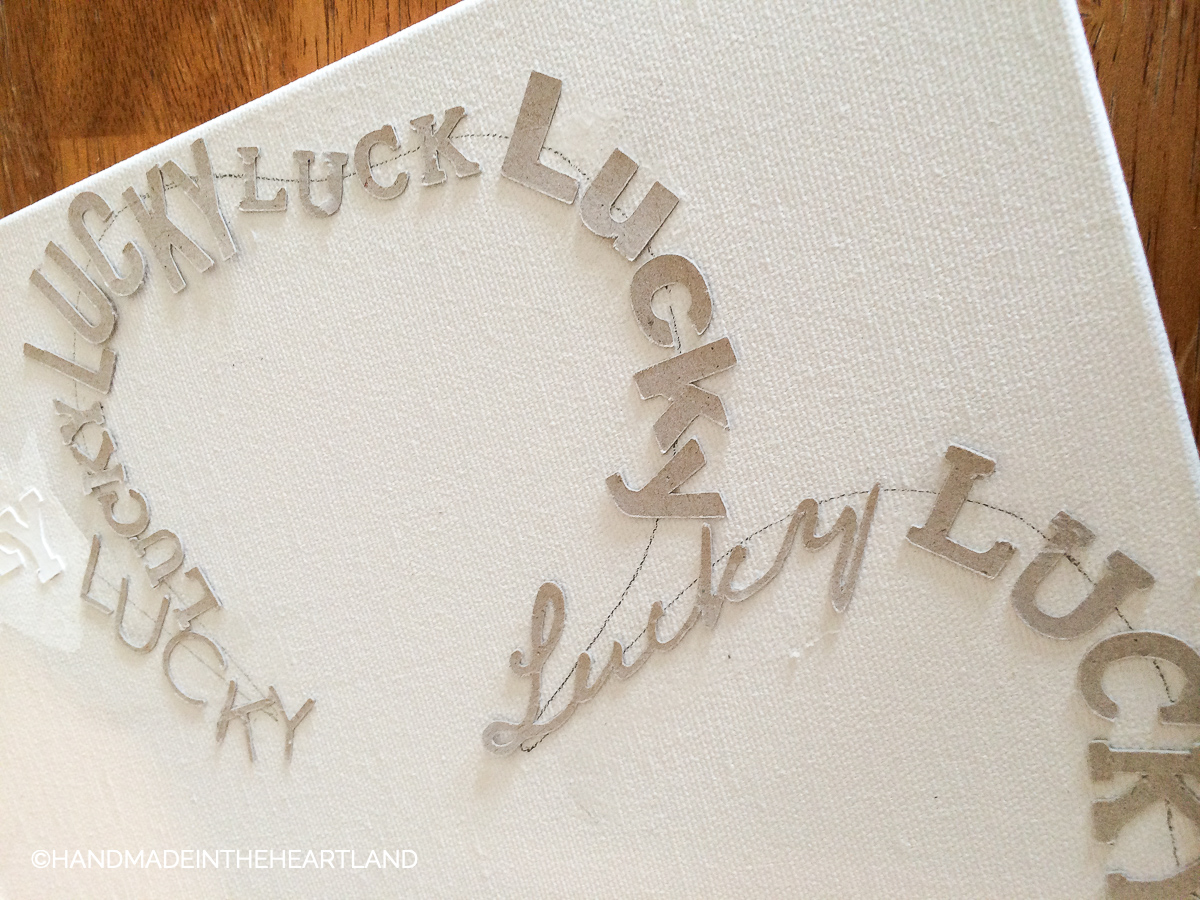 chipboard letters in the shape of a 4 leaf clover