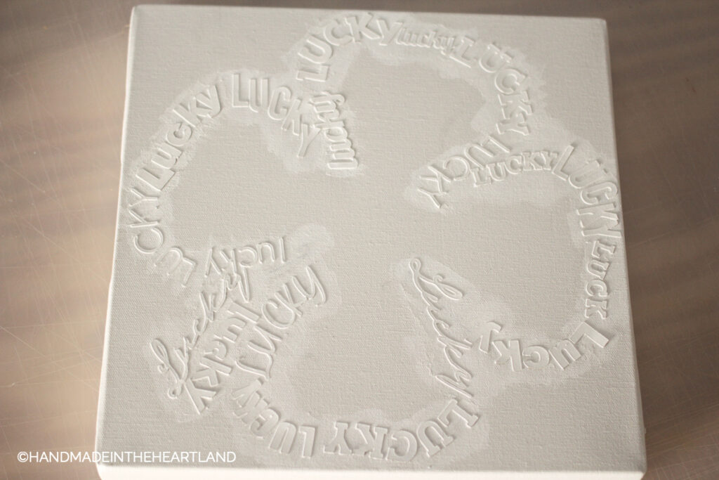 lucky chipboard letters painted white on white canvas