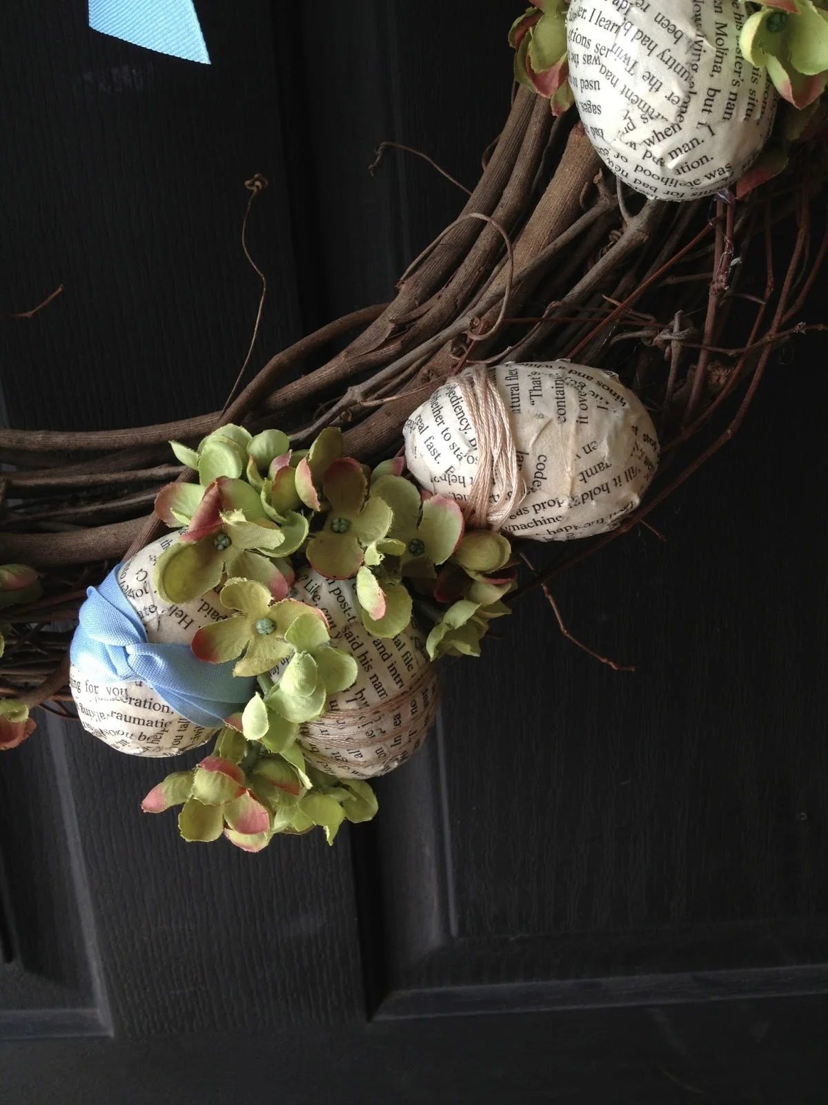 Decoupaged easter eggs with book pages and ribbon