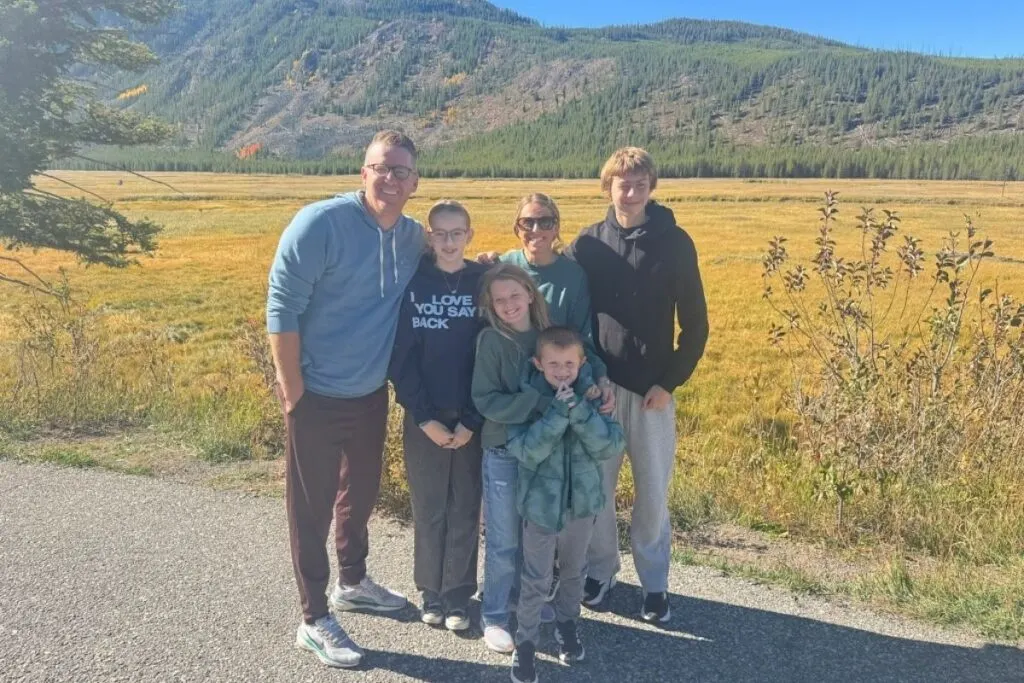Family photo in Yellowstone with kids in the fall